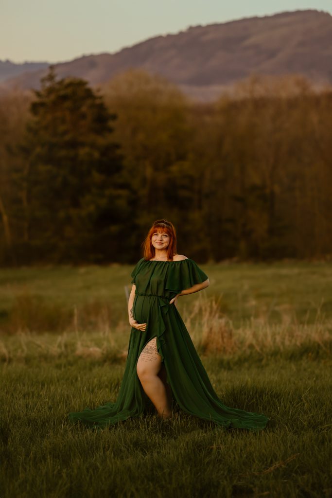 maternity photography purple flowers mom holding belly green dress golden hour concord new hampshire gilford