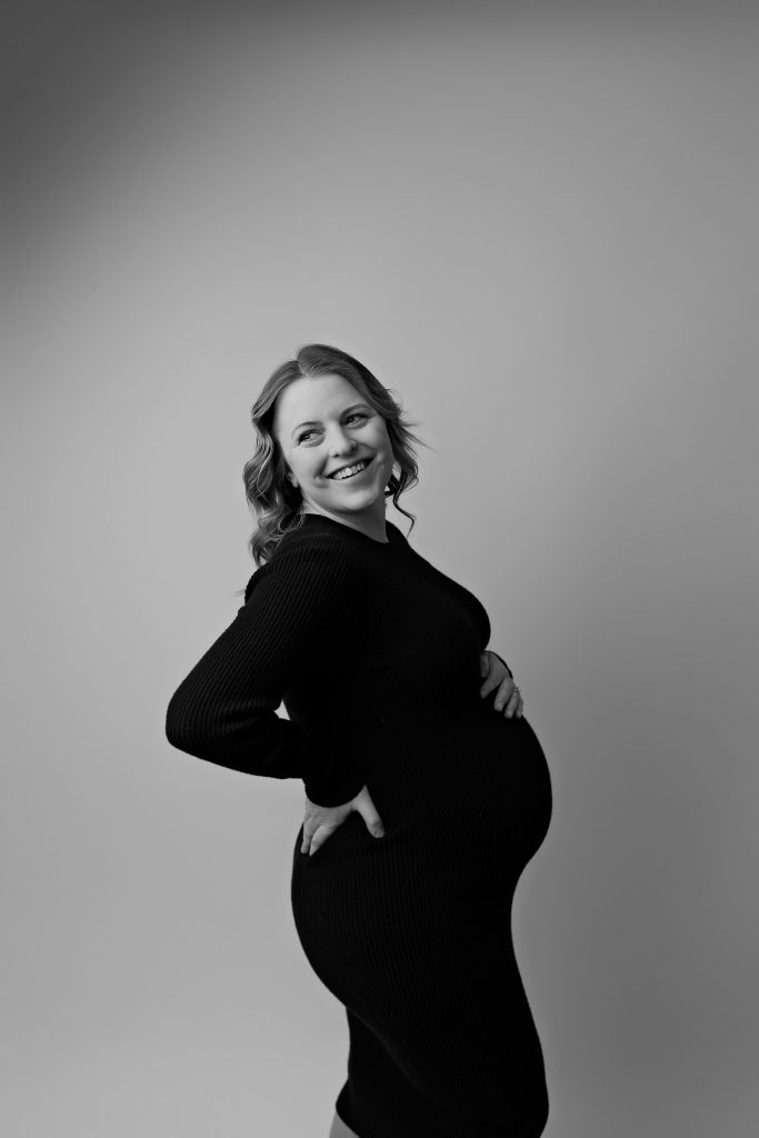 maternity photography black and white black dress short hair solid backdrop concord new hampshire studio