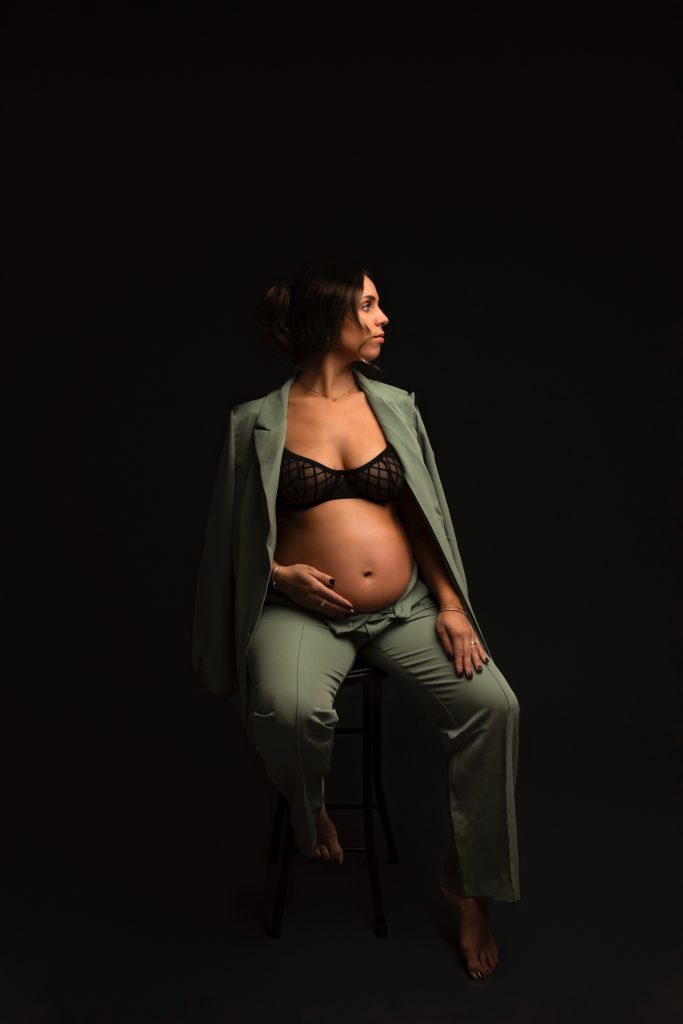 maternity photography black backdrop bralette open belly jeans concord new hampshire studio green sport coat business