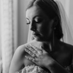 Wedding photography bride posing with wedding ring bishop farm weddings and events wedding venue new hampshire black and white window