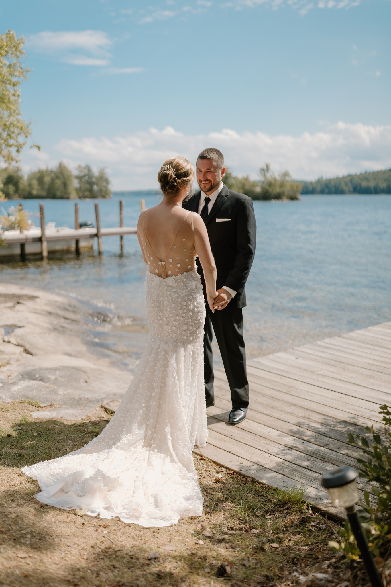 wedding photography bride and groom holding hands squam lake new hampshire