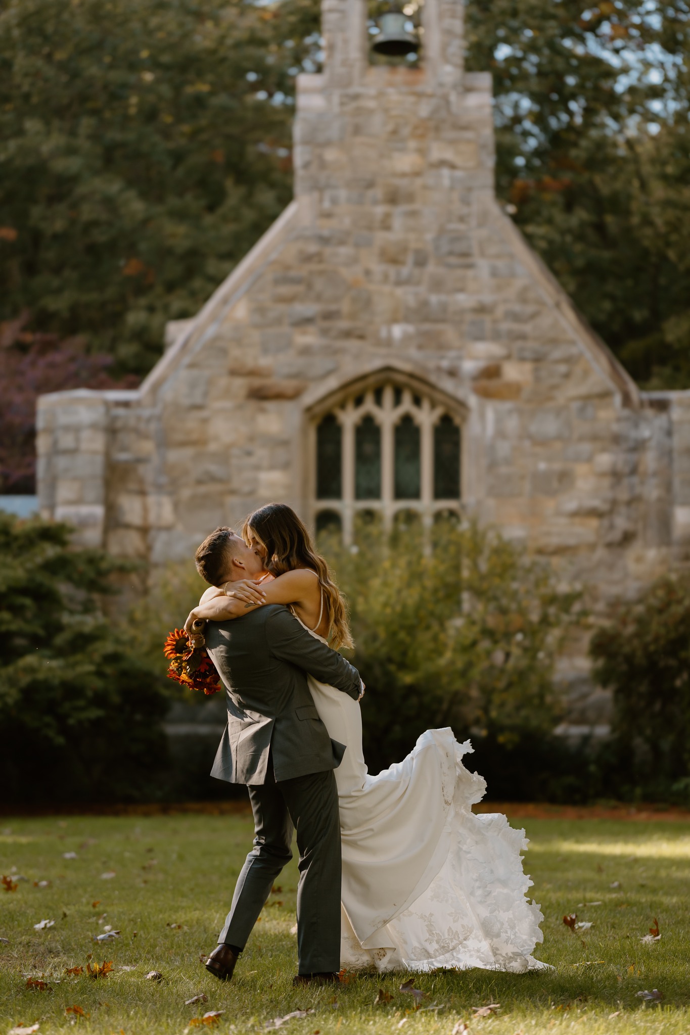 wedding photography bride and groom twirling kissing hugging alvirne memorial chapel new hampshire derry