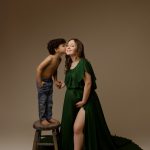 maternity photography mom holding son kissing holding belly green dress golden hour concord new hampshire studio