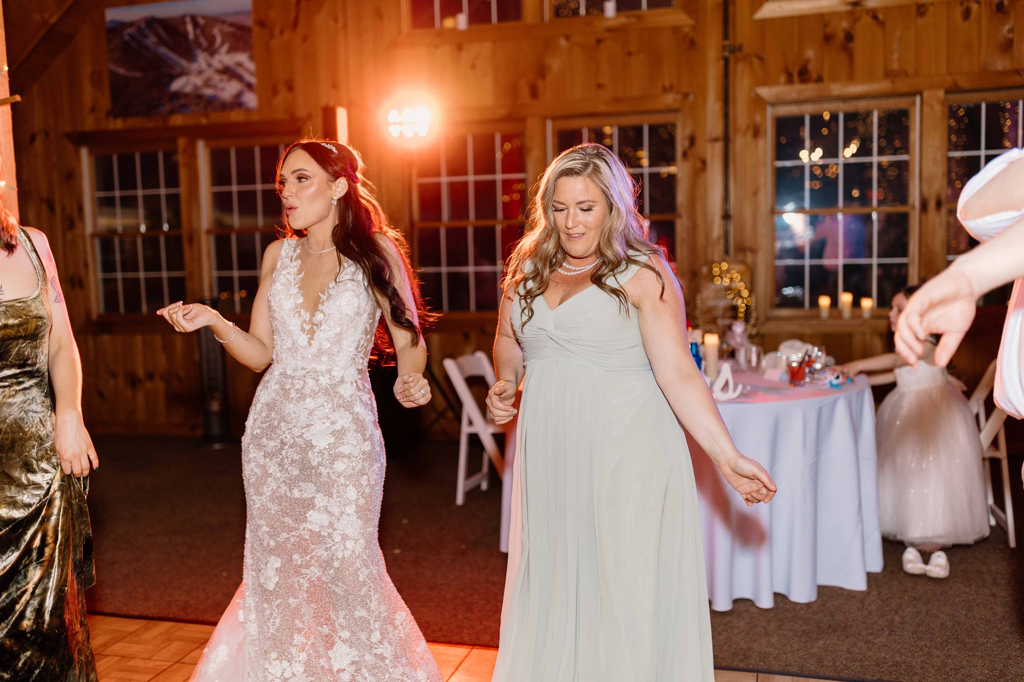 wedding photography bridal party dancing at reception at Pike's Peek venue new hampshire bride and daughter dancing