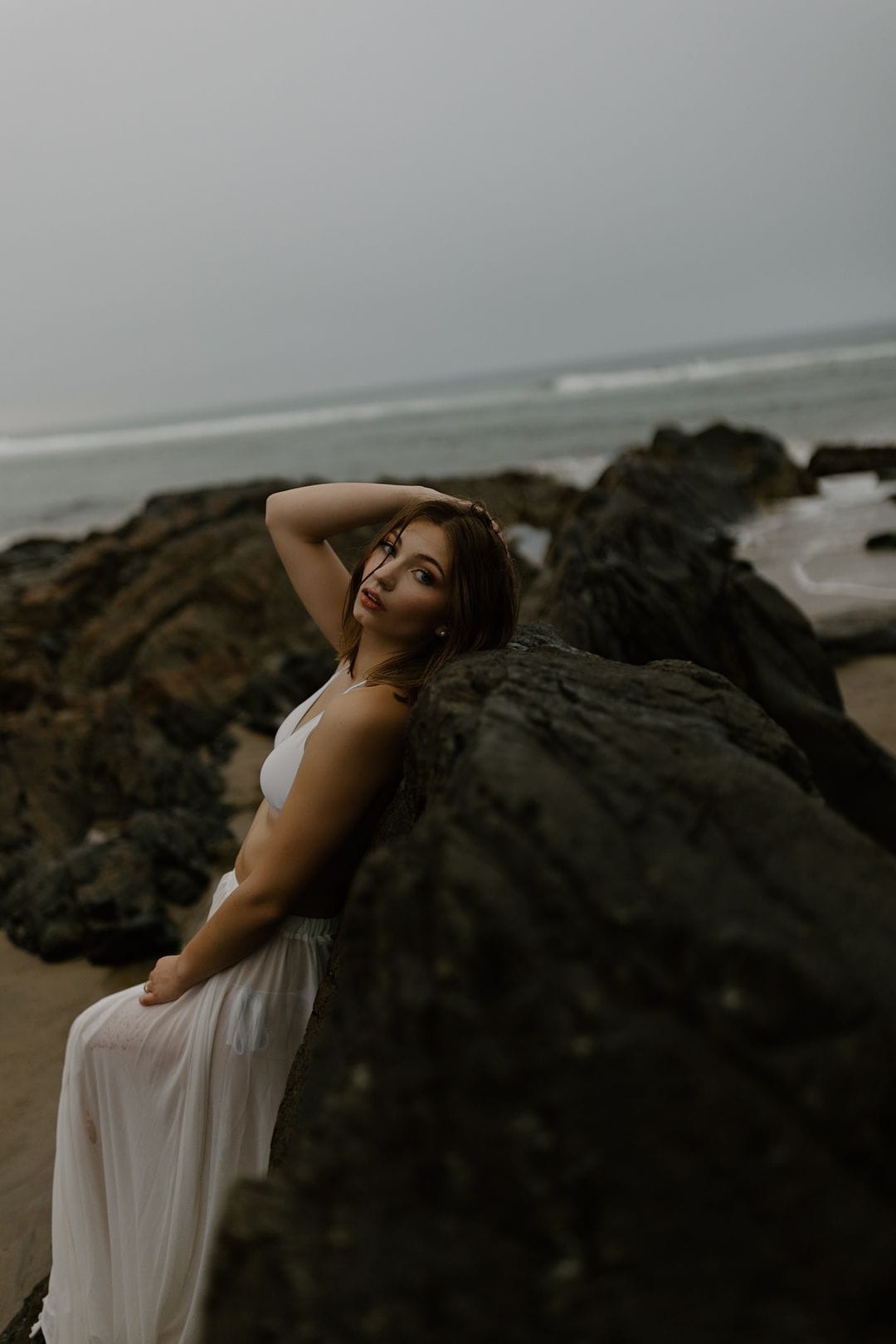portrait photography beach ocean rocks white top skirt wet hair concord new hampshire