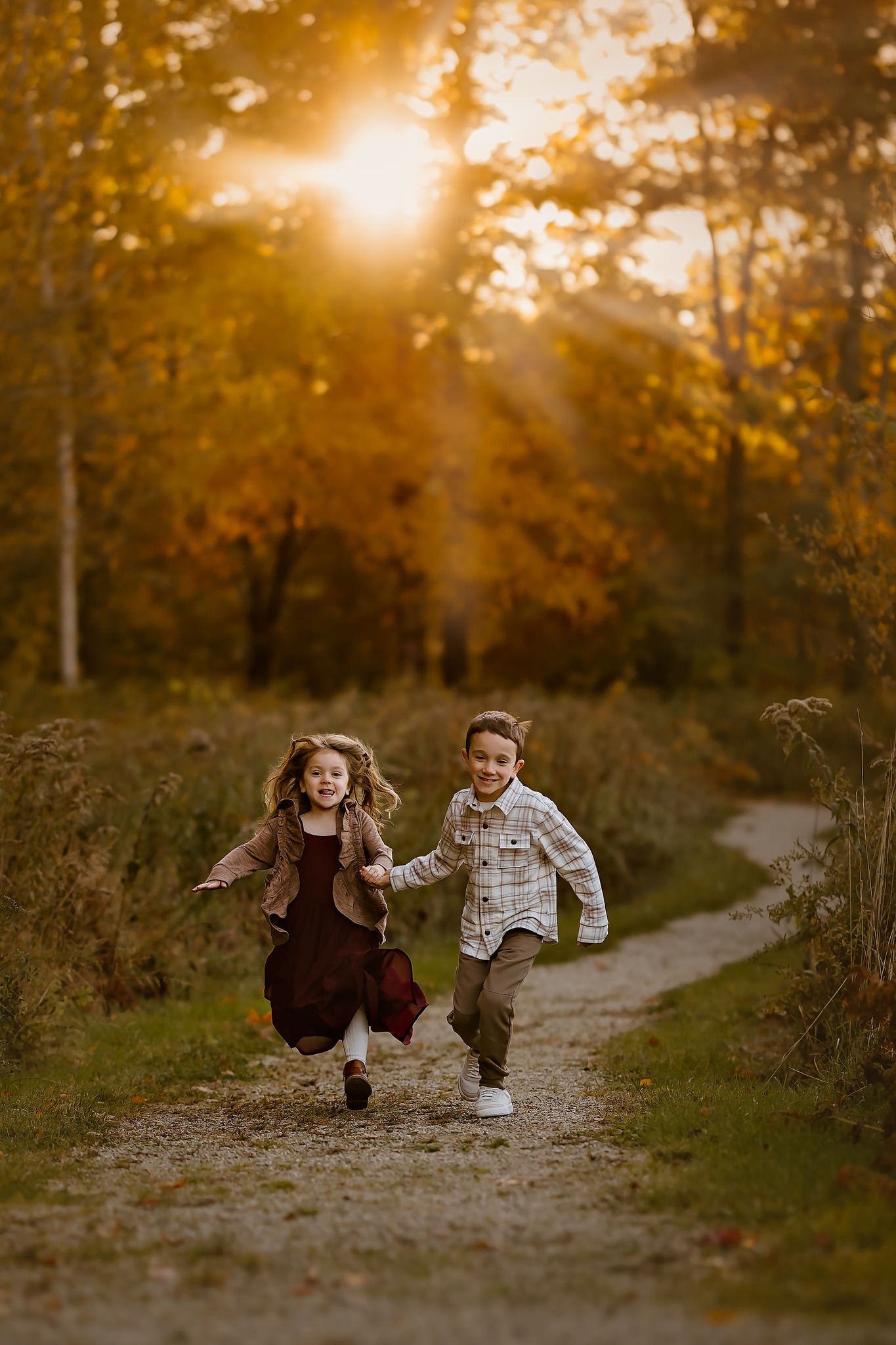 family photography brother and sister running holding hands outdoors trail park concord new hampshire sunset golden hour