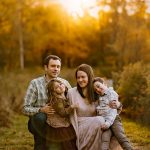 family portrait photography brother sister mom dad hugging snuggling outside sunset golden hour concord new hampshire