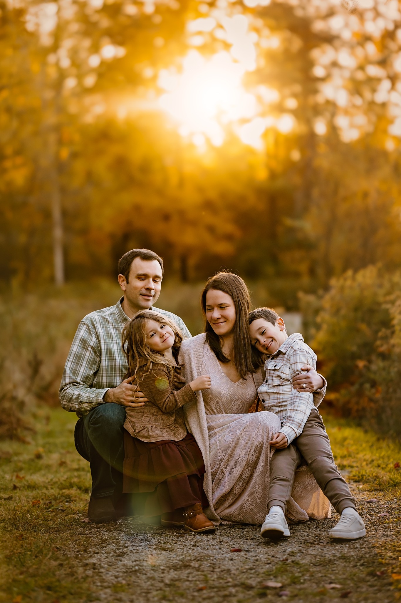 family portrait photography brother sister mom dad hugging snuggling outside sunset golden hour concord new hampshire