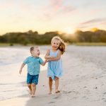 portrait photography family kids childhood beach sand ocean sunset golden hour running holding hands blue dress shirt brother sister boy girl concord new hampshire