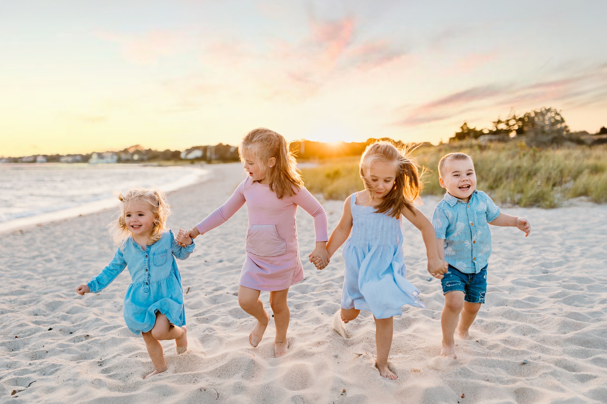 portrait photography family kids childhood beach sand ocean sunset golden hour running holding hands blue dress shirt brother sister boy girl concord new hampshire cousins sisters