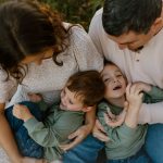 family portrait photography brother sister mom dad hugging snuggling outside sunset golden hour concord new hampshire