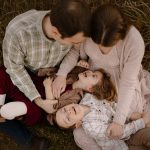 family portrait photography brother sister mom dad hugging snuggling outside sunset golden hour concord new hampshire