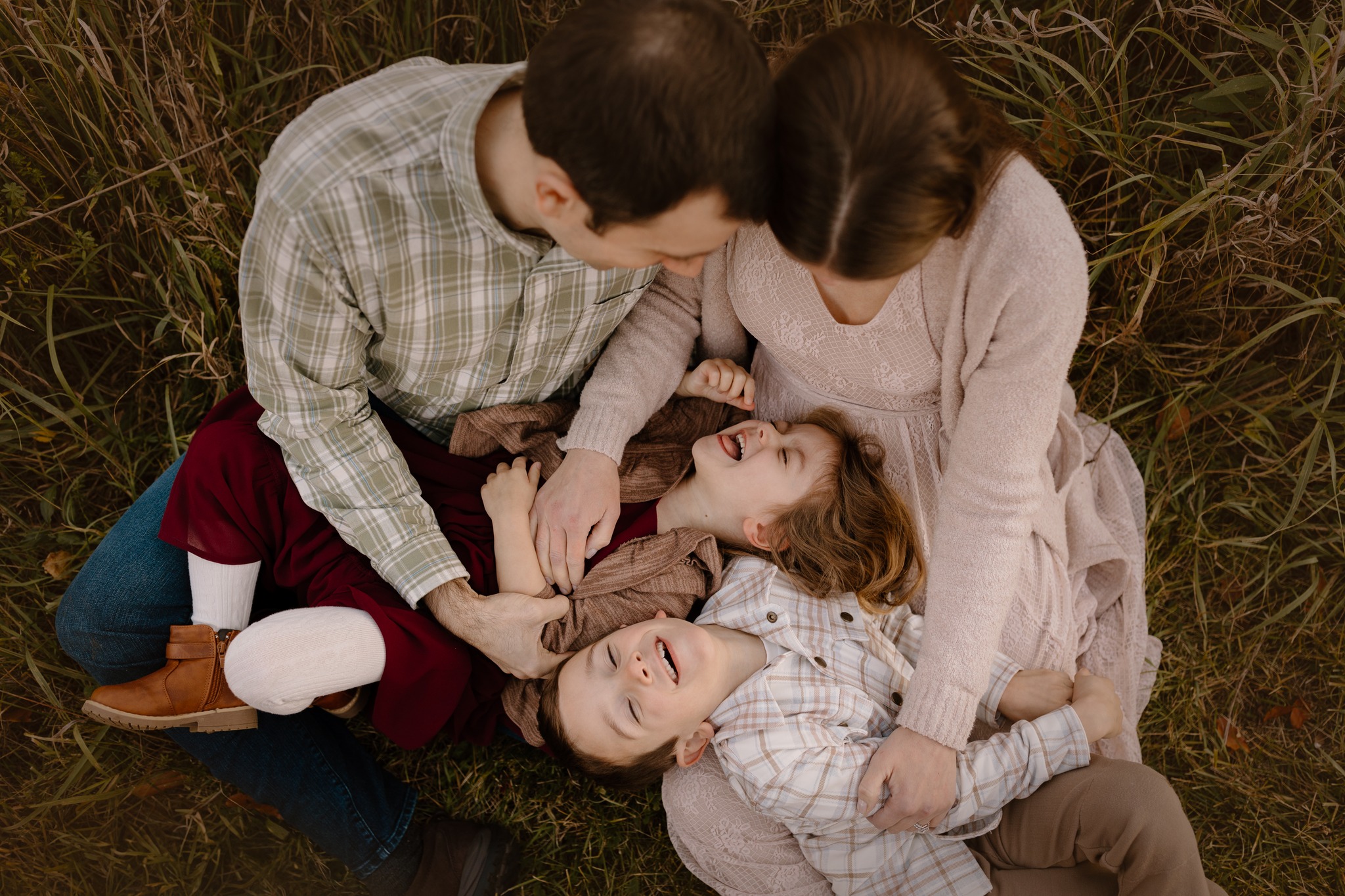 family portrait photography brother sister mom dad hugging snuggling outside sunset golden hour concord new hampshire