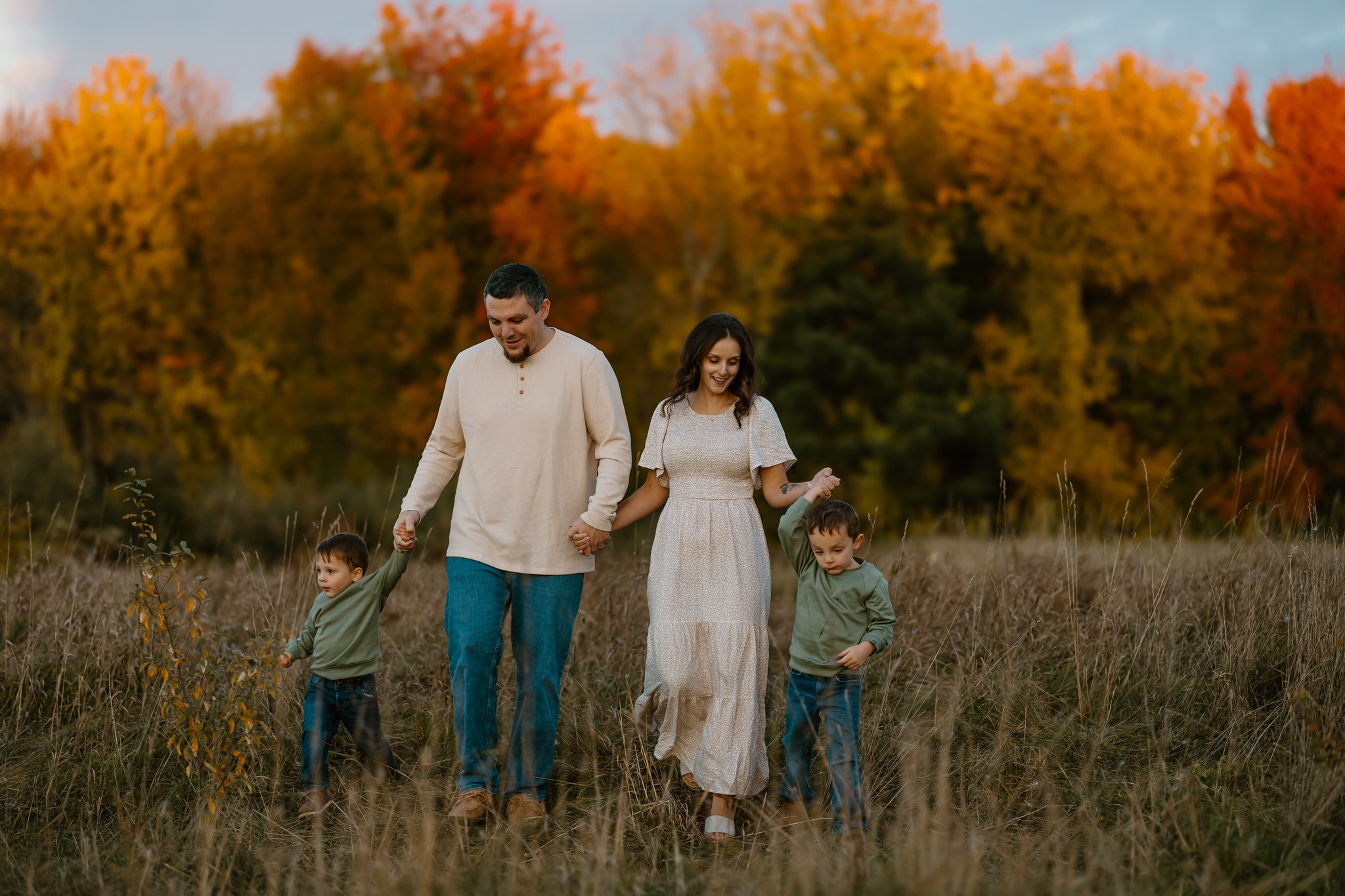 family portrait photography brother sister mom dad hugging snuggling outside sunset golden hour concord new hampshire