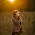 girl blowing dandelion portrait photography sunset golden hour concord new hampshire childhood milestone portrait