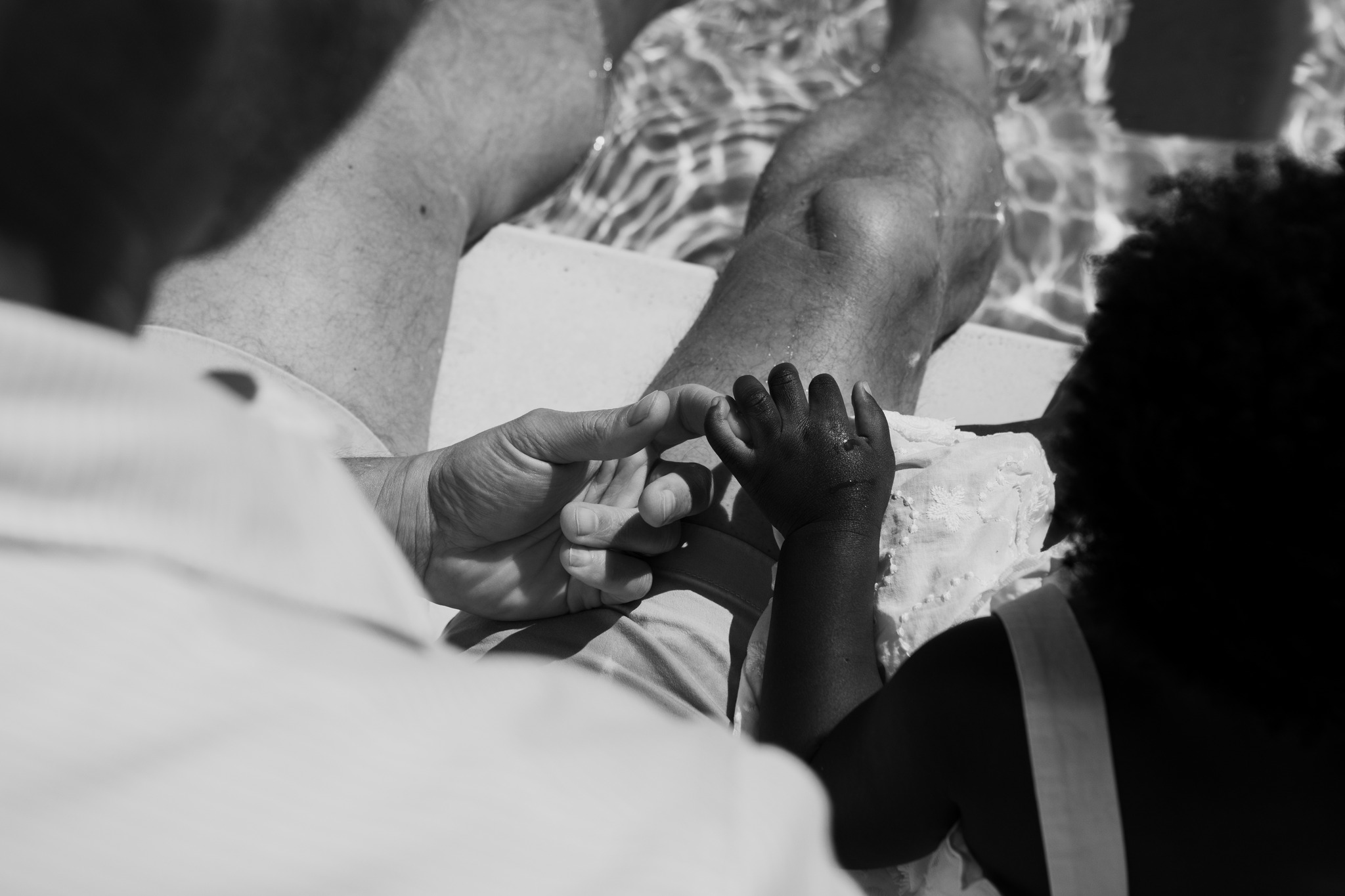 black and white family portrait holding hands pool concord new hampshire