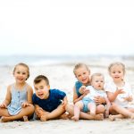 portrait photography family kids childhood beach sand ocean sunset golden hour running holding hands blue dress shirt brother sister boy girl concord new hampshire cousins sisters