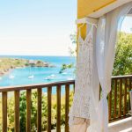 wedding photography new hampshire virgin islands water island weddings Caribbean ocean beach wedding white sand bride and groom holding hands walking down beach little sugar bird rings wedding dress
