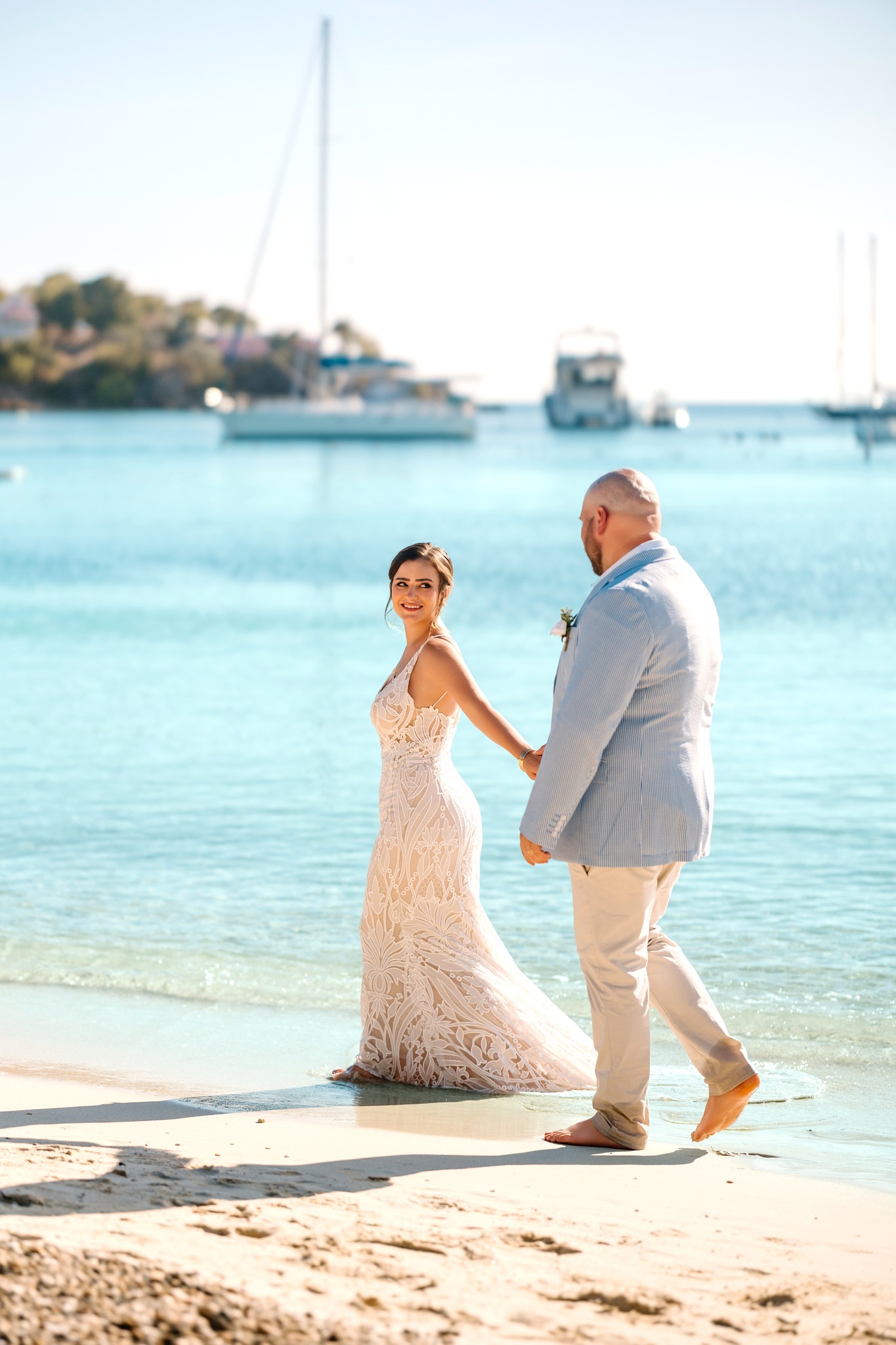 wedding photography new hampshire virgin islands water island weddings Caribbean ocean beach wedding white sand bride and groom holding hands walking down beach