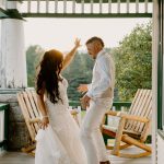wedding photography coleman state park new hampshire bride and groom sitting in adirondack chairs on farmers porch sunset golden hour wedding dress dancing