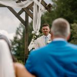 wedding photography bride and groom walking down isle holding hands bouquet coleman state park new hampshire wedding venue