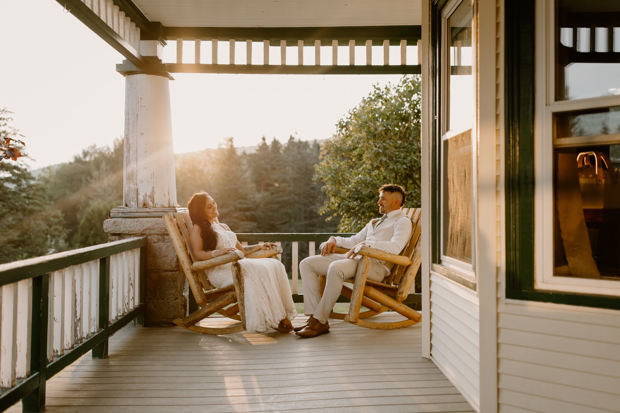 wedding photography coleman state park new hampshire bride and groom sitting in adirondack chairs on farmers porch sunset golden hour wedding dress