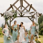 wedding photography coleman state park bride and bridesmaids posing under arbor new hampshire