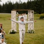 wedding photography bride and groom walking down isle holding hands bouquet coleman state park new hampshire wedding venue