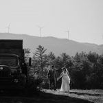 wedding photography black and white bride and groom windmills holding hands old truck yeaton family farm new hampshire