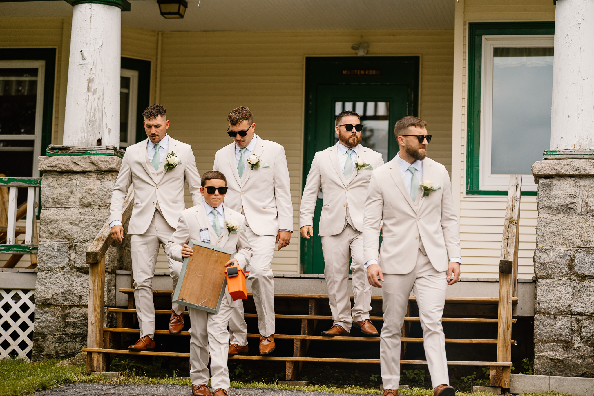 wedding portrait of groomsmen and ring bearer, walking towards the ceremony, nh