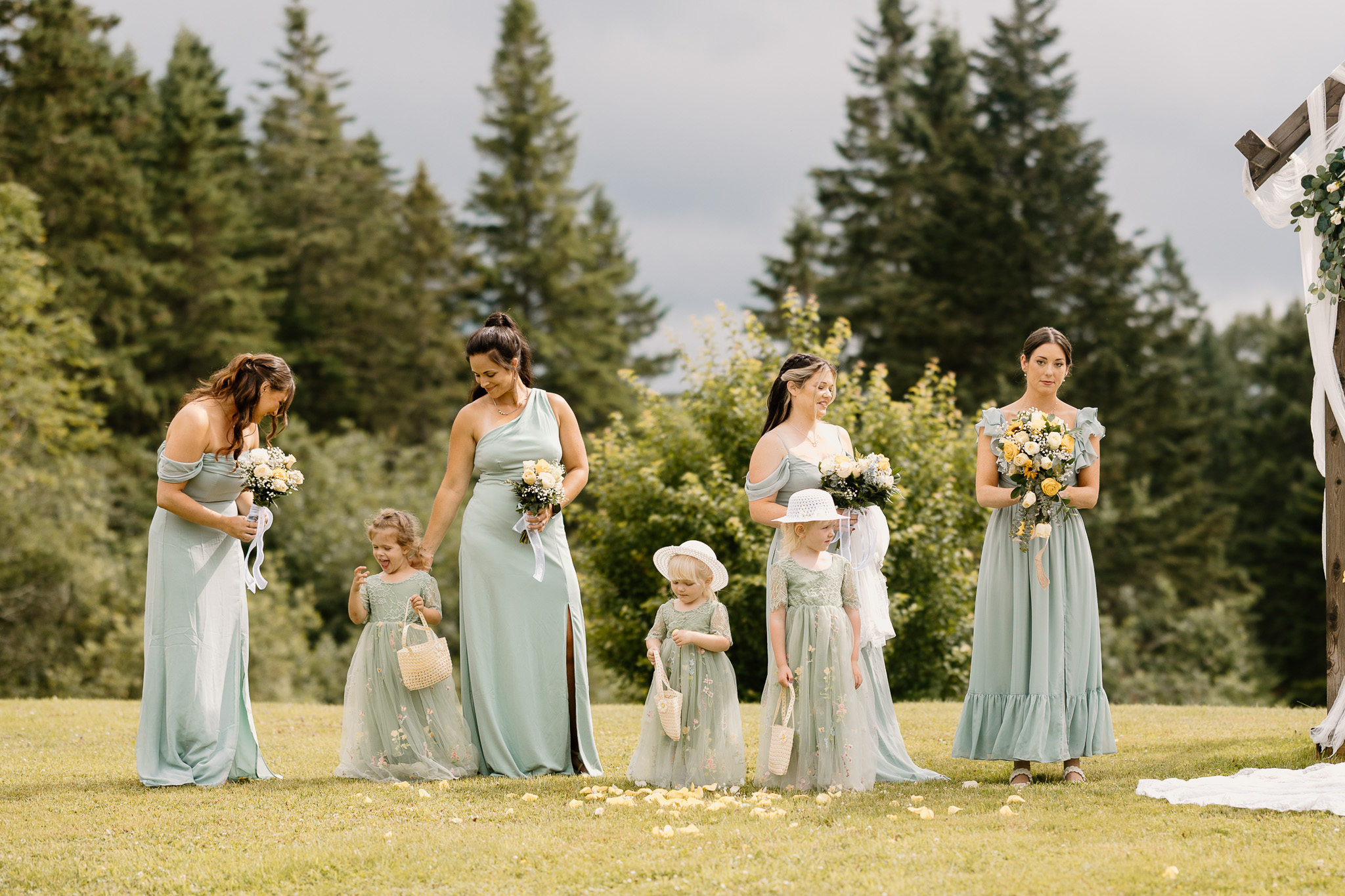 wedding portrait of bridesmaids and flower girls standing at alter, nh