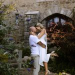 wedding portrait where husband is picking up bride and touching foreheads, hammond castle, ma