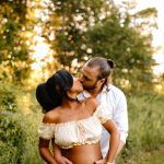 Maternity portrait where mom and dad are holding each other, hands on belly, white dress, sunset, golden hour, NH