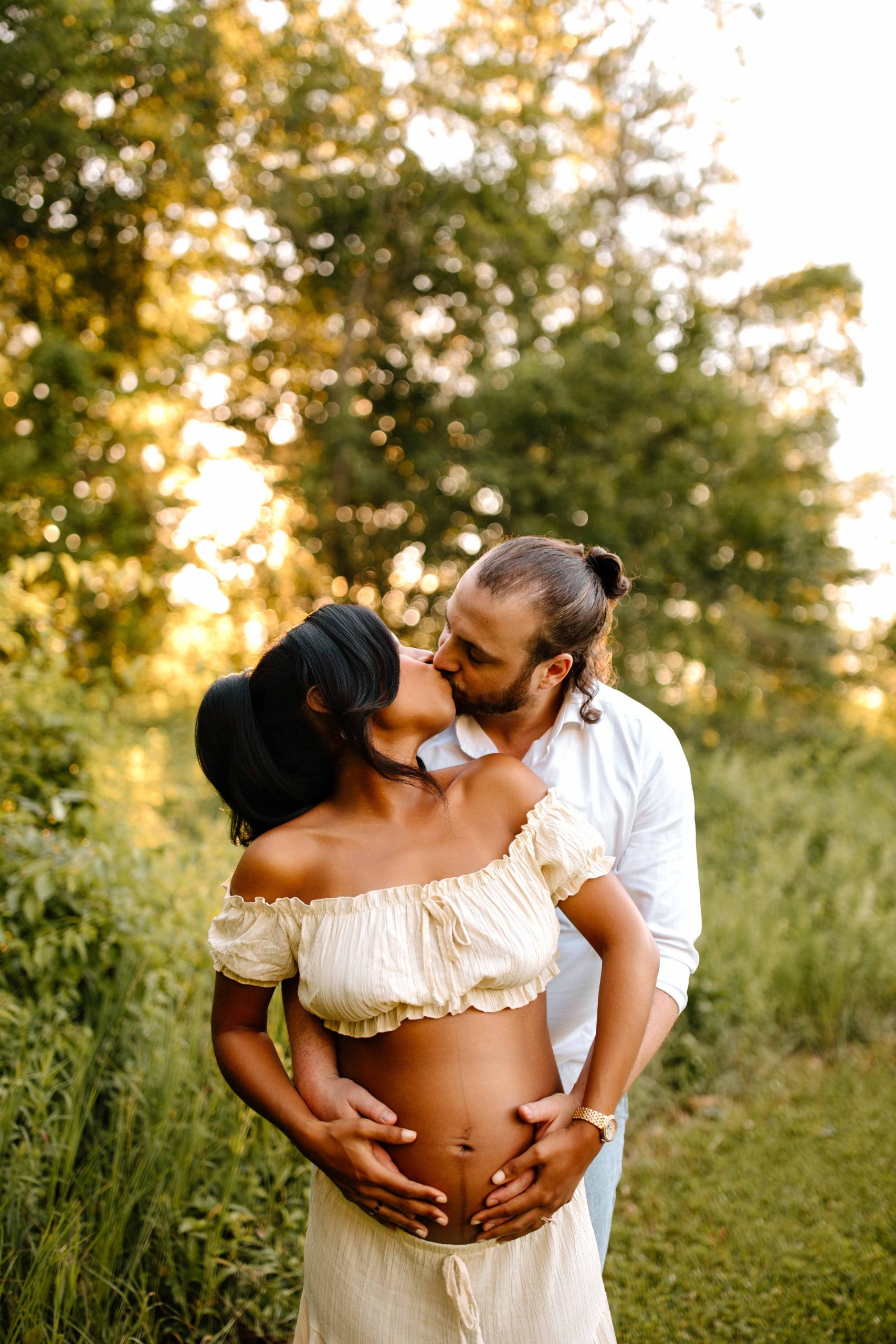Maternity portrait where mom and dad are holding each other, hands on belly, white dress, sunset, golden hour, NH