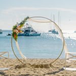 Bride and groom exchange vows during a beach wedding ceremony on Water Island, St. Thomas, USVI, surrounded by tropical ocean views.