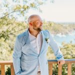 Bride and groom exchange vows during a beach wedding ceremony on Water Island, St. Thomas, USVI, surrounded by tropical ocean views.