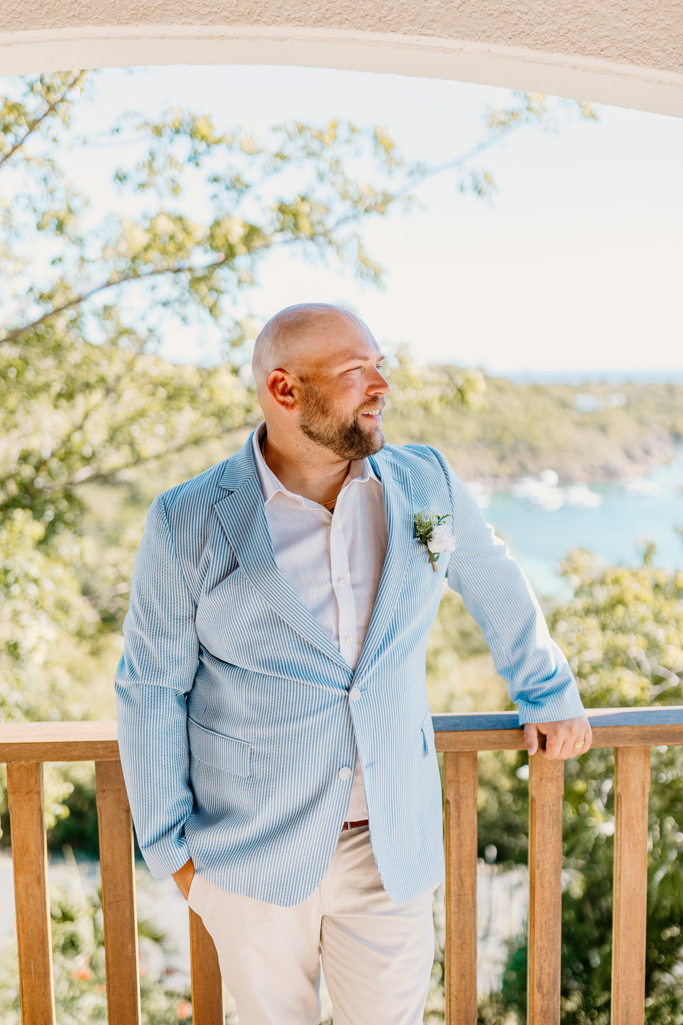 Bride and groom exchange vows during a beach wedding ceremony on Water Island, St. Thomas, USVI, surrounded by tropical ocean views.